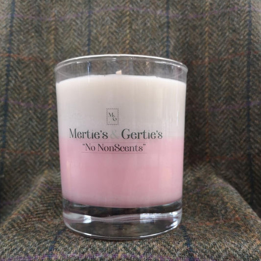 A candle where the top half is cream and the bottom half is pink. half way down the colour will create a soft pink colour.It's in a clear glass and can last for between 40 - 42 hours