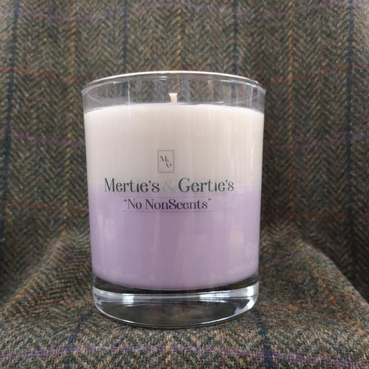A candle where the top half is cream and the bottom half is lilac. It's in a clear glass and can last for up to 40hrs